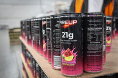 Fire Up Watermelon Lemonade cans coming off the canning line